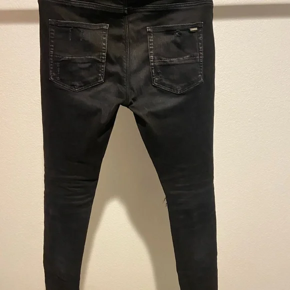 AMIRI Black Distressed Skinny Jeans
